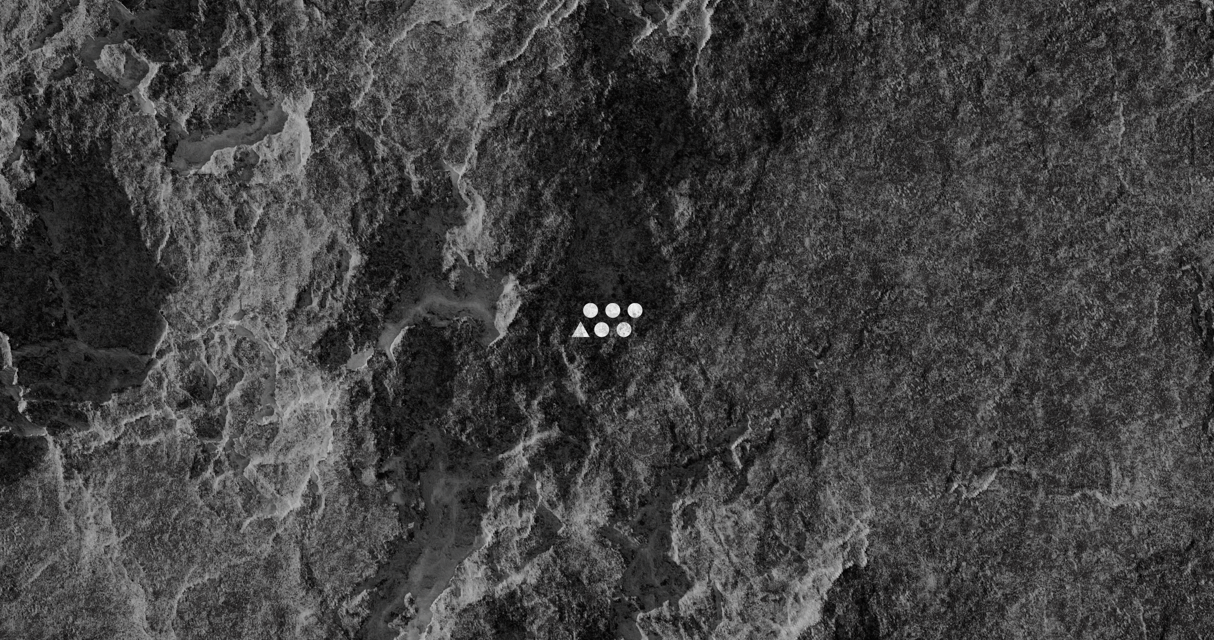 A stone texture with the Offcut logo